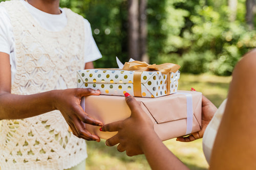 Girl giving gifts to another girl