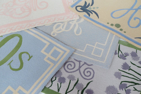 Design Your Own Rug, Rugs layered in blue, pinks and purples. Monogrammed rugs