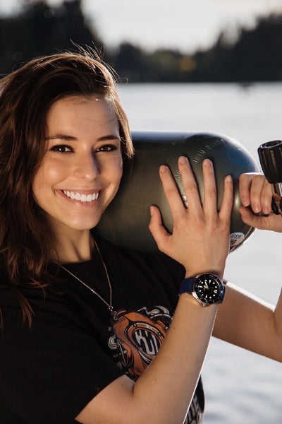 Scuba diver holding scuba tank