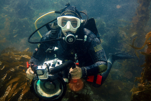 Ren Taylor scuba diving with underwater photography gear