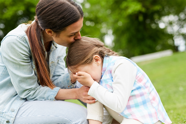 mom consoling crying child