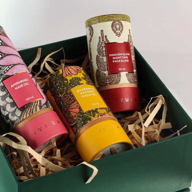 Manjish Glow Elixir and other iYURA products showing off their beautiful packaging with Madhubani painting