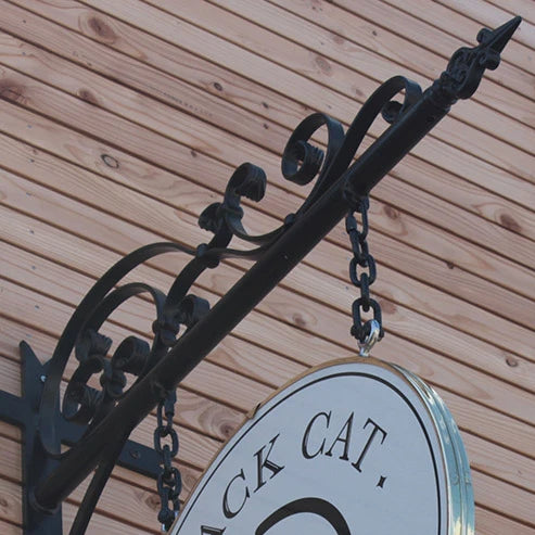 Black Cat round square sign on wrought-iron bracket