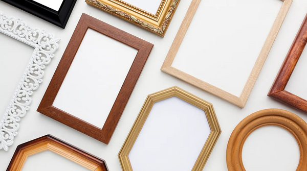 A collection of empty picture frames laid down