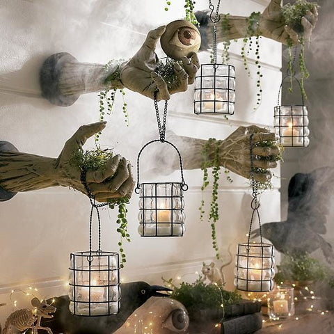 Wall mounted hand sconces holding lanterns with fog effect