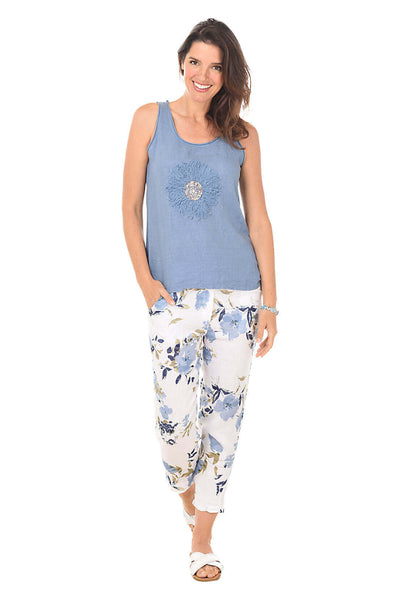 Crystal wearing a blue sequined tank top and a floral crop pant, both by Kaktus