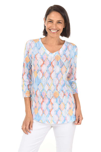Camille wearing a pastel-colored French Dressing knit top