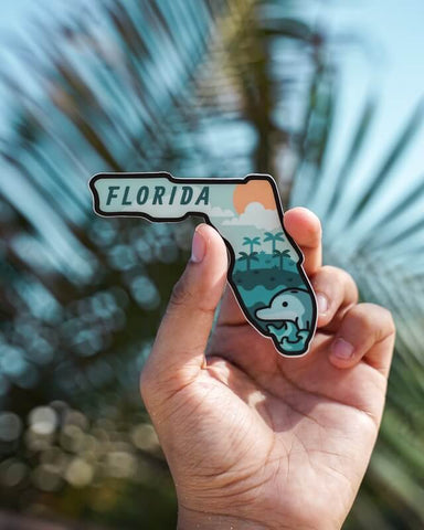 Hand holding a florida sign