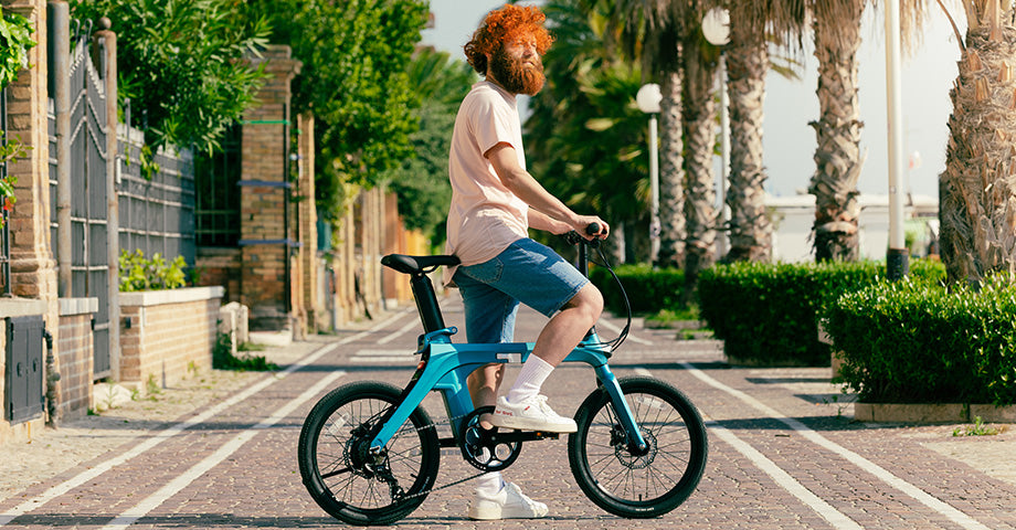 Man riding electric bike on road