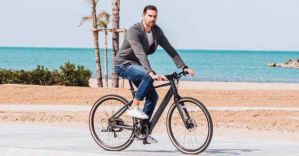 Man riding electric bike on the beach