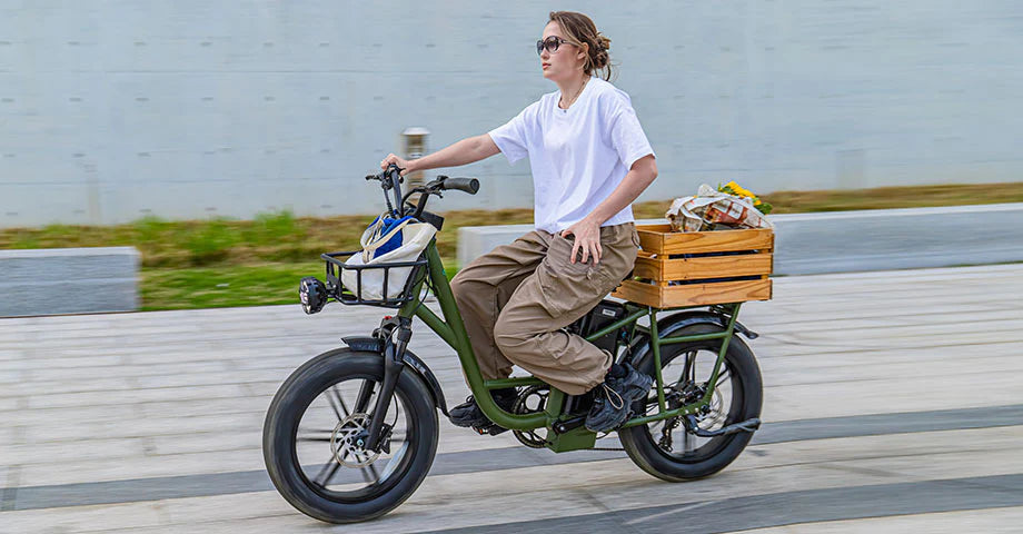 A young woman rides a Fiido T1Pro electric bike around town