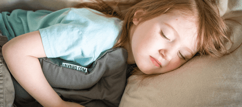 Little girl sleeping with Lavabag heating pad