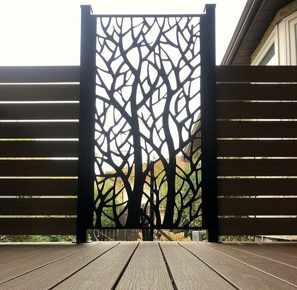 Woodland aluminum privacy screen between wood slat privacy screens on a deck