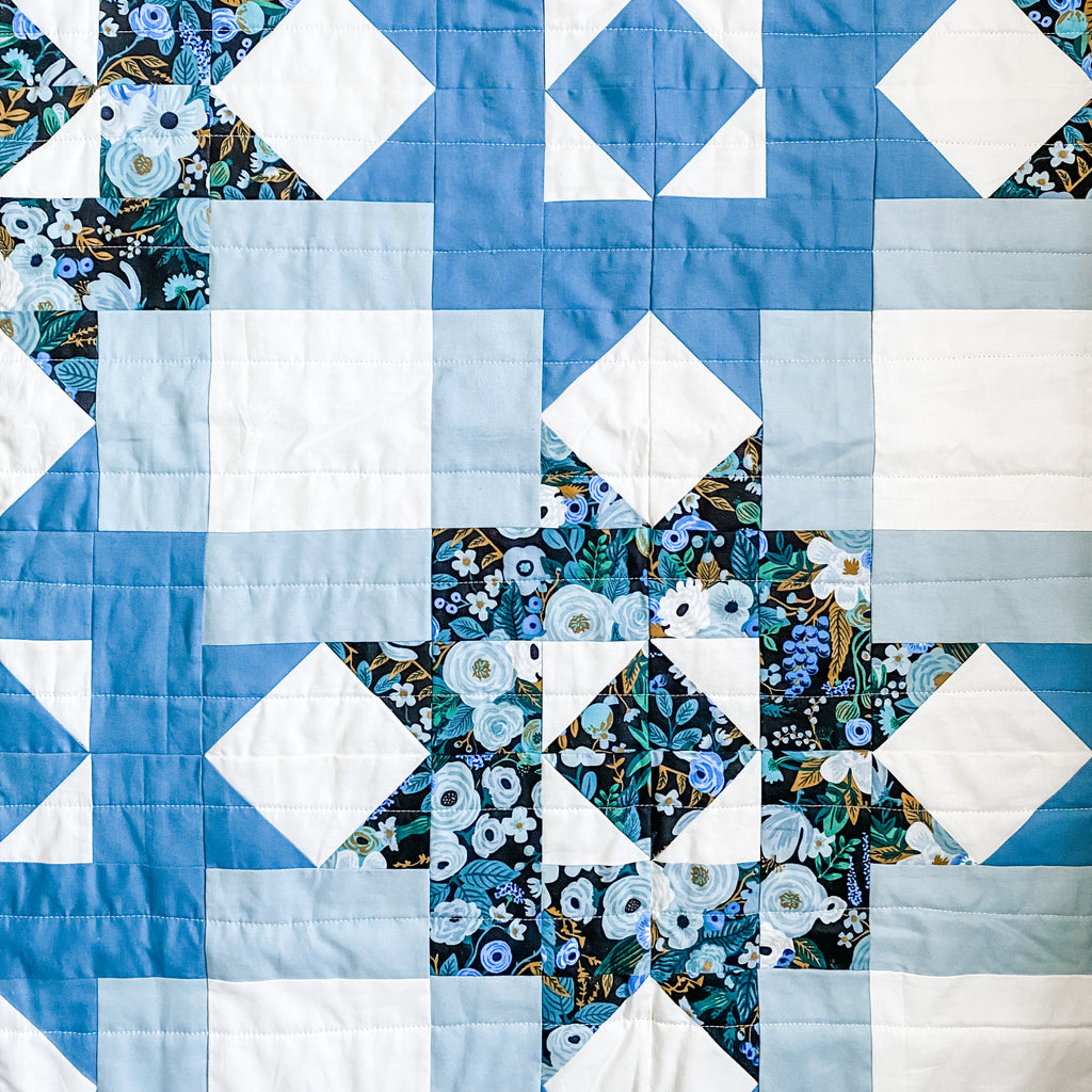 petal points baby quilt in kona cotton blue and rifle paper co garden party fabric