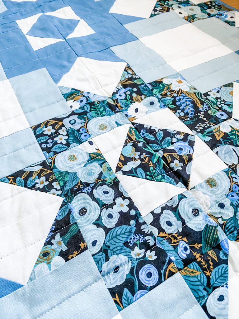 petal points baby quilt in kona cotton blue and rifle paper co garden party fabric