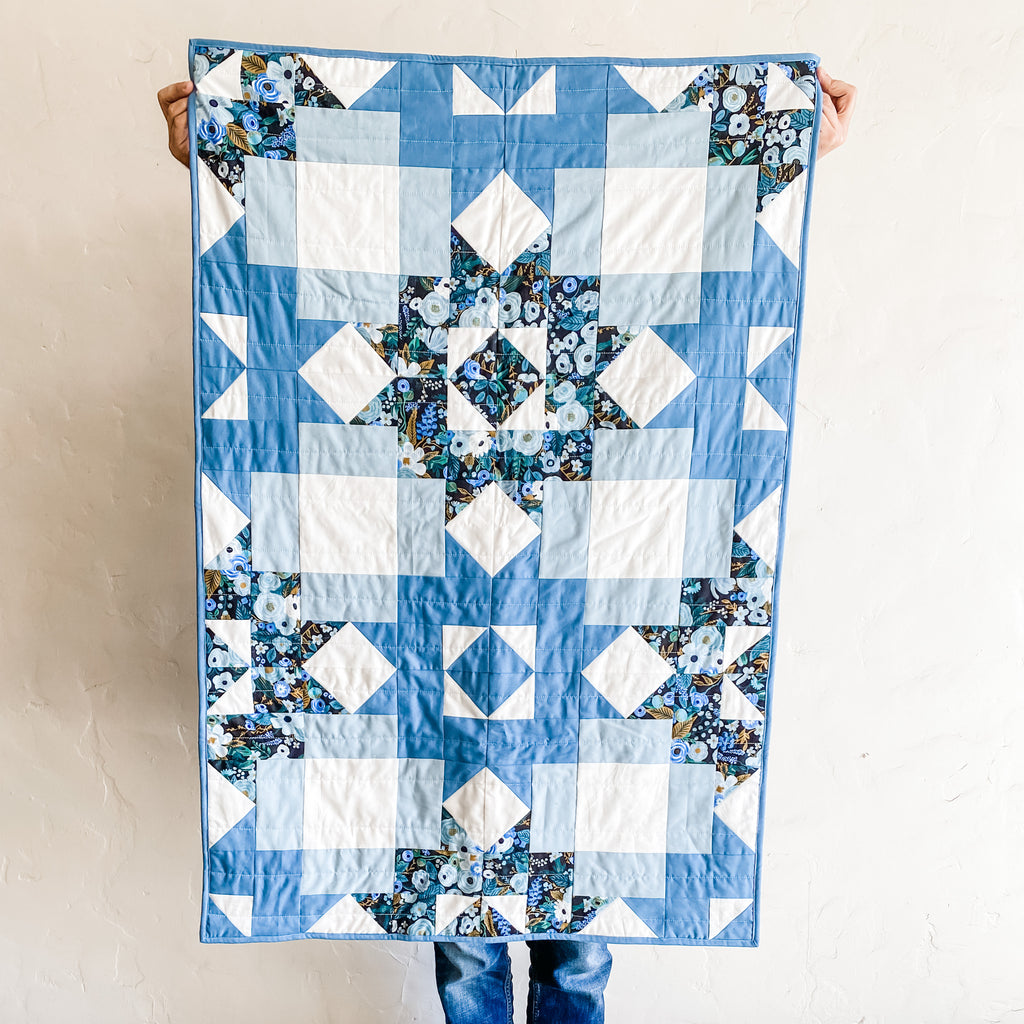 petal points baby quilt in blue kona cotton and rifle paper co fabric