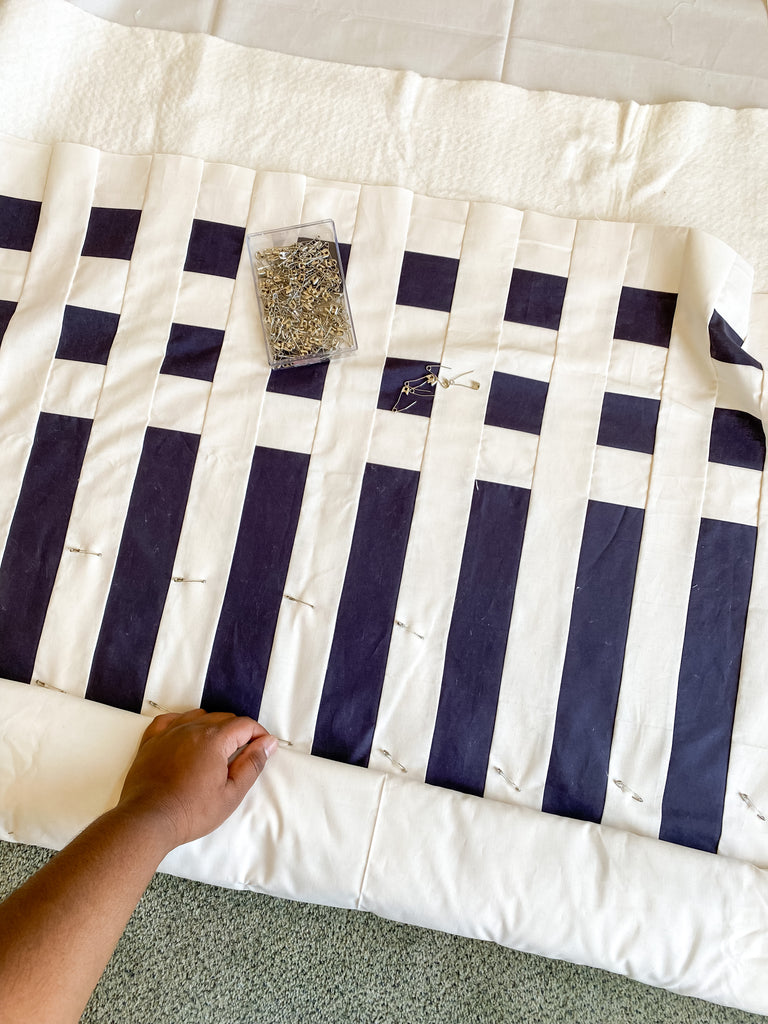 pin basting a quilt - simple stripes quilt by strawberry creek quilts