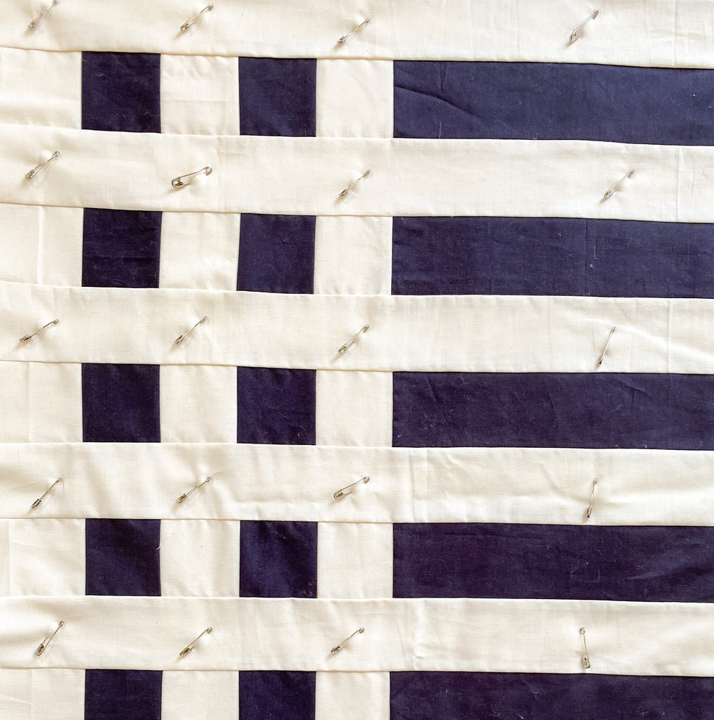 how to baste a quilt - simple stripes quilt black and white basted