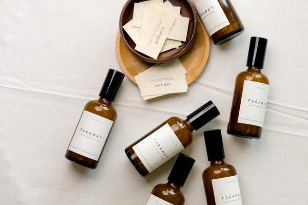 A flat lay of Amber Bottles- Room and linen Mist