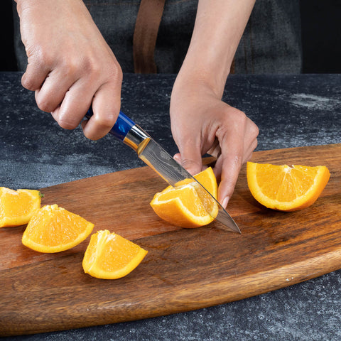 Cerulean Blue Resin Paring Knife by Senken Knives Cutting Oranges