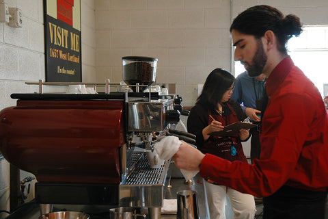 Mike Strumpf preparing espresso in a mid 2000s barista competition at Intelligentsia Coffee.