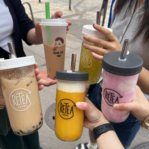 Five cups of bubble, four of them are in reusable glass cups.