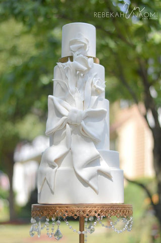 white wedding bow cake