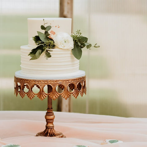 wedding cake on gold cake stand