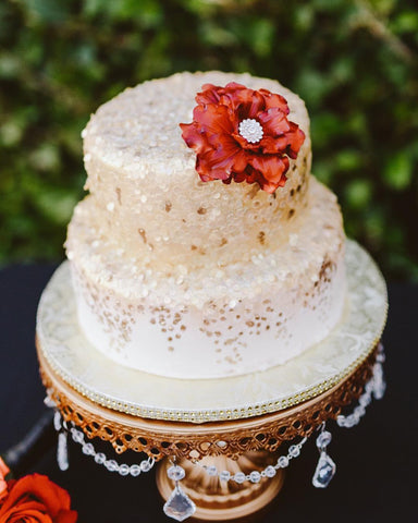 elegant glitter wedding cake on gold cake stand