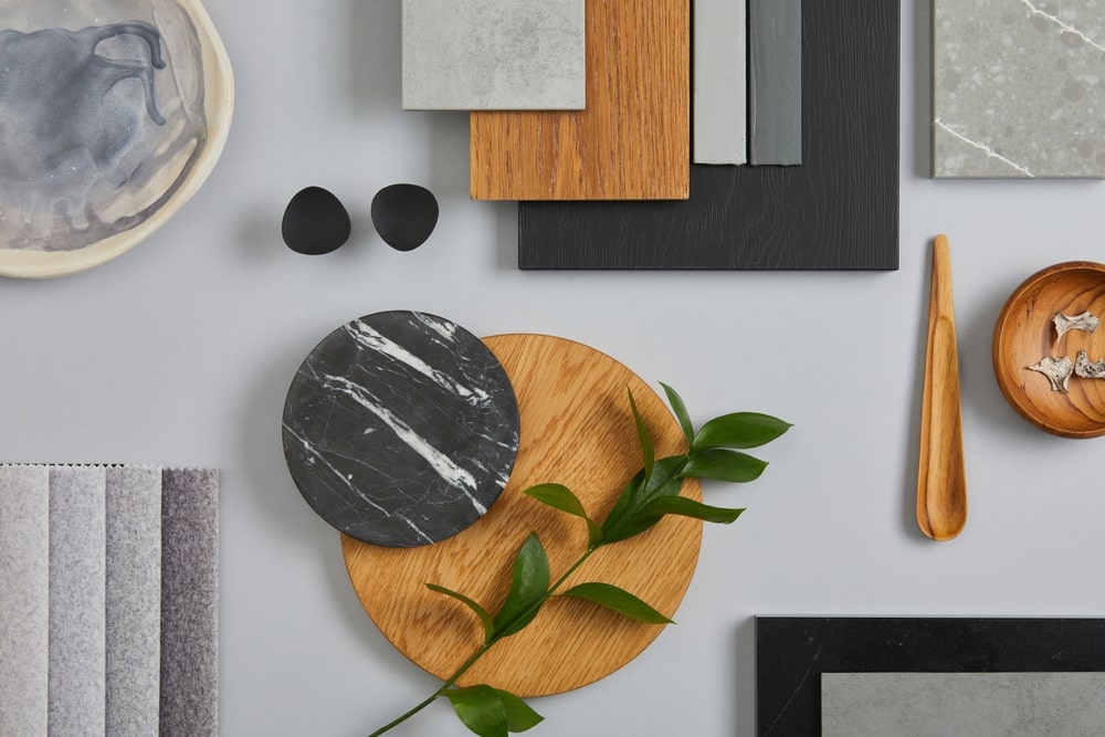 Design Mood Board With Granite, Wood And Green Leaves