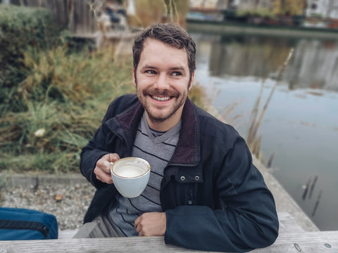 canadian man drinking coffee in montreal