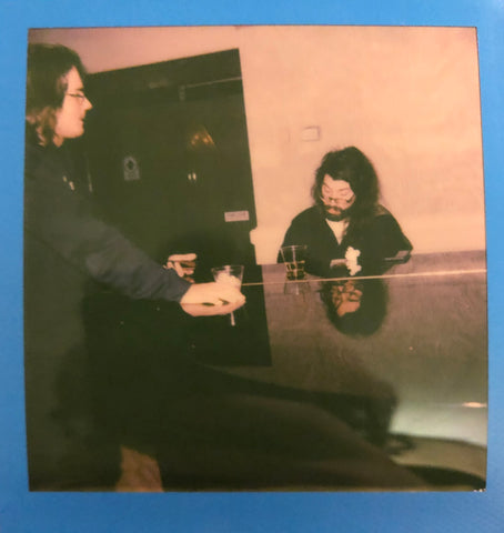 Riley McDonnell watches Quave Glass play piano in Las Vegas 2020 at Glass Vegas. Riley had no idea he was talking to until the moment this picture was taken by a random guy with a polaroid camera.