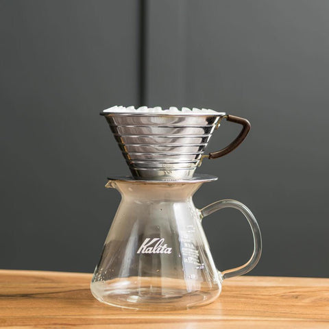 Kalita Wave coffee dripper on top of glass server.