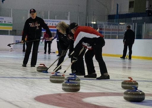 Firkin Whisky, Glenfaclas 105 single malt scotch, and curling stones on ice