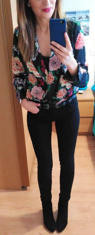 Heavy Printed dark floral blazer with a dark blouse tucked in to a pair of jeans