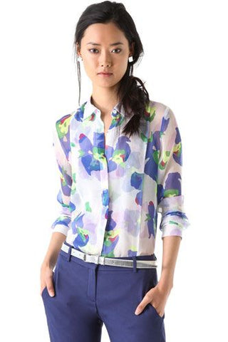 Heavy printed floral shirt tucked in to a pair of pants