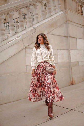 Long floral skirt with a knit sweater