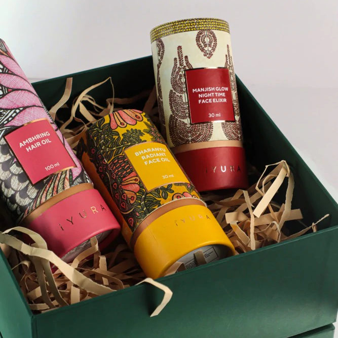 Manjish Glow Elixir and other iYURA products showing off their beautiful packaging with Madhubani painting