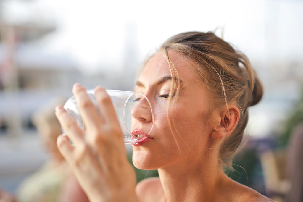 woman drinking glass of water