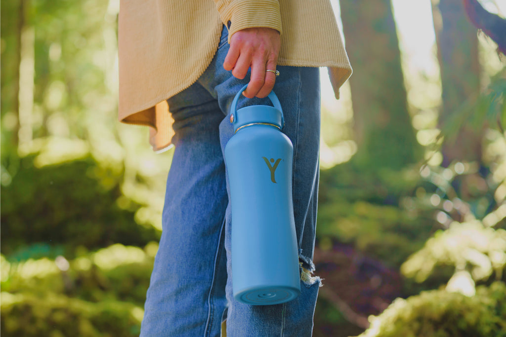 dyln alkaline water bottle outdoors forest on the go