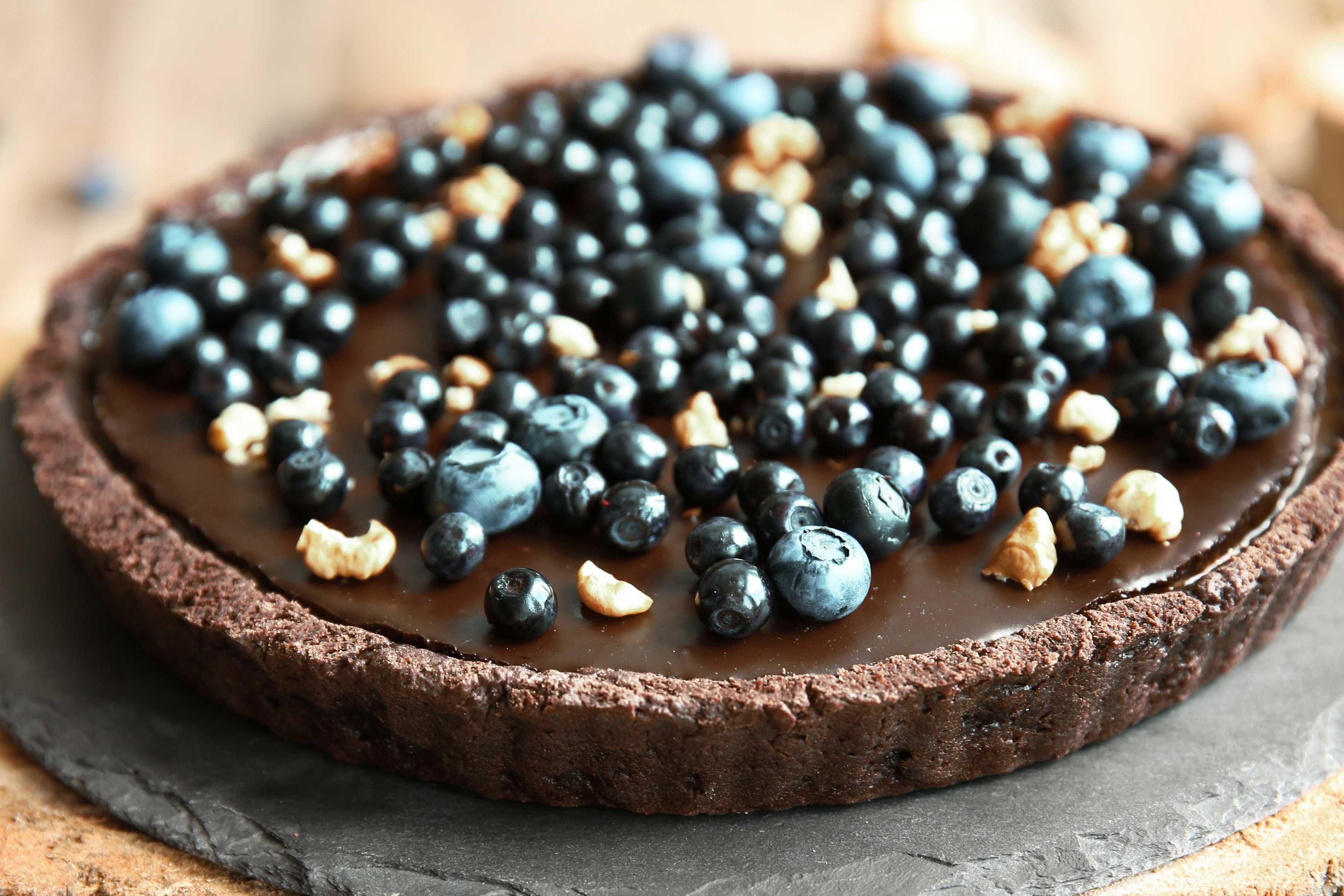 Chocolate tart topped with blueberries.