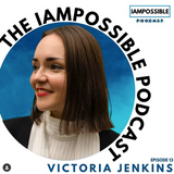 A white back ground has a circular photo in it. The background inside is a variety of blues. A headshot photo of Victoria is in the centre. She has bobbed brown hair in a centre parting and is smiling to the left of the photo. She is wearing red lipstick, a black jacket and a white striped top. Text around the circle says The Iampossible podcast. It is episode 13.