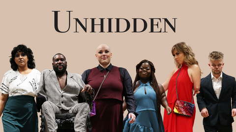 6 disabled and diverse models on the runway at London Fashion Week wearing Unhidden's range of adaptable clothing. Above them, is Unhidden's logo in black with a camel background