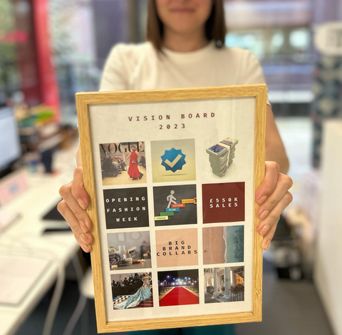 A close up of Victoria's visionboard - a framed pictures of 12 smaller images including Unhidden on the front cover of Vogue, money, a beach, text reading "big brand collaborations" and the red carpet steps from the Met Gala