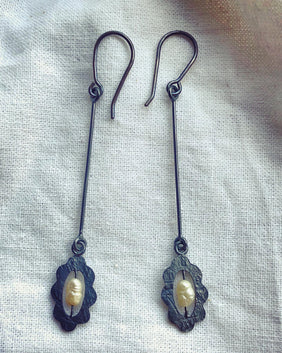 Photo of handmade long dangle earrings made in oxdised sterling silver with pearls