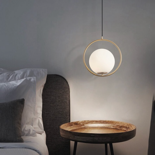 perfect installation height for a pendant light over a bedside table in New Zealand 2021 round opal glass modern design brass