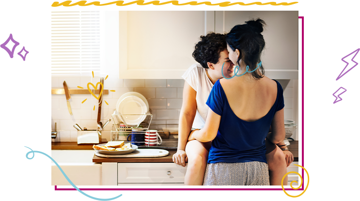 Couple in kitchen embracing