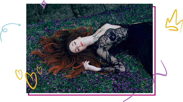 Woman laying in a field of flowers