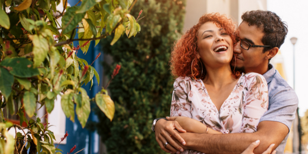 Couple smiling and embracing in hug