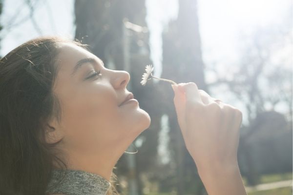 Women smelling flower